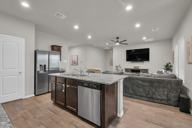 Thanks to the open layout, natural light flows easily from room to room—keeping the heart of the home bright, welcoming, and wonderfully social. | Image 12