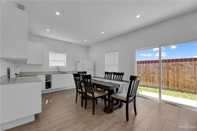 Dining area with sink and light hardwood / wood-style floors | Image 14