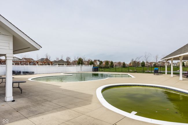 Amenities include multiple swimming pools, a fitness/workout center, playgrounds, a 15-acre park, dog park, racquet courts, a clubhouse w/ banquet facilities, miles of biking and walking paths and more! | Image 51
