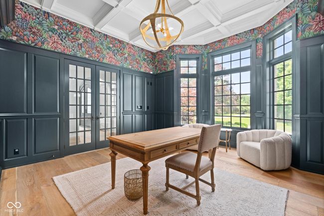 home office with french doors, coffered ceiling, light wood-style floors, wallpapered walls, and healthy amount of natural light | Image 38