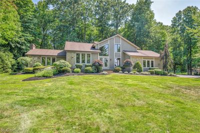 Split level home featuring a front yard | Image 2