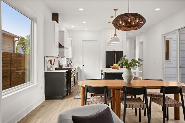 Dining space featuring baseboards, light wood finished floors, and recessed lighting | Image 5