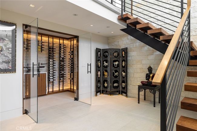 The distinctive lower level offers exceptional amenities: stylish wine cellar, state-of-the-art movie theater, utility room, 3/4 bath and direct access to the finished three-car garage. | Image 23