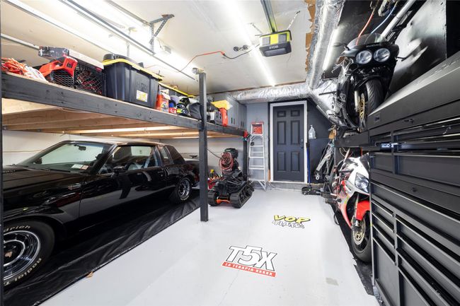 Garage with a garage door opener | Image 22