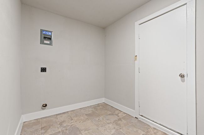 Laundry area with baseboards and hookup for an electric dryer | Image 12