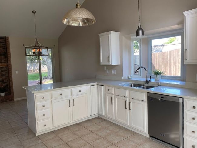 Another view of the kitchen into the dining room. | Image 6