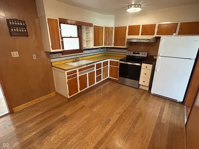 All appliances stay with home, including basement refrigerator and stove. | Image 17