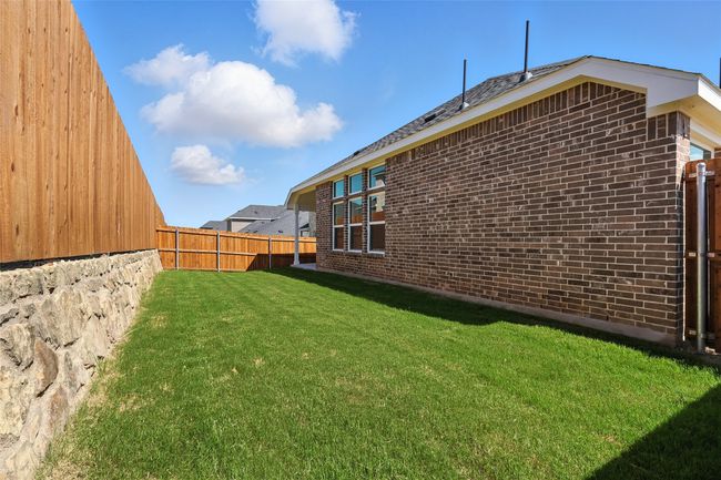 View of fenced backyard | Image 33