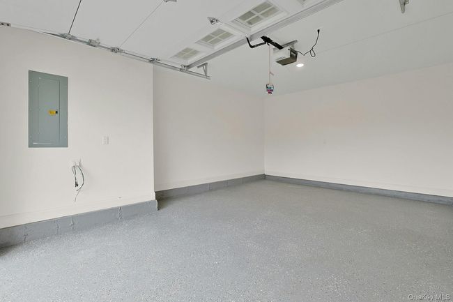 Garage with epoxy flooring. | Image 28