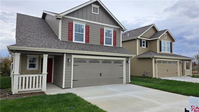 Craftsman house with covered porch and a garage | Image 1