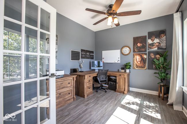 office with ceiling fan and wood finished floors | Image 4