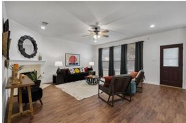 Living area with a ceiling fan, wood finished floors, a fireplace, and recessed lighting | Image 27