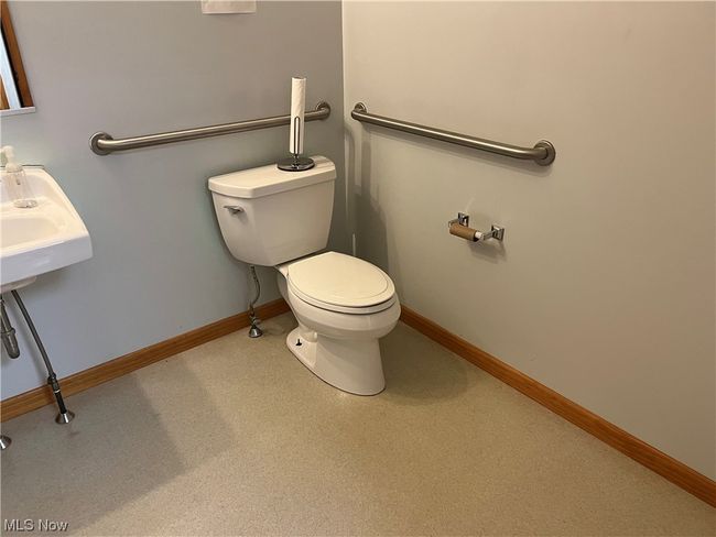 Bathroom with toilet and sink | Image 8