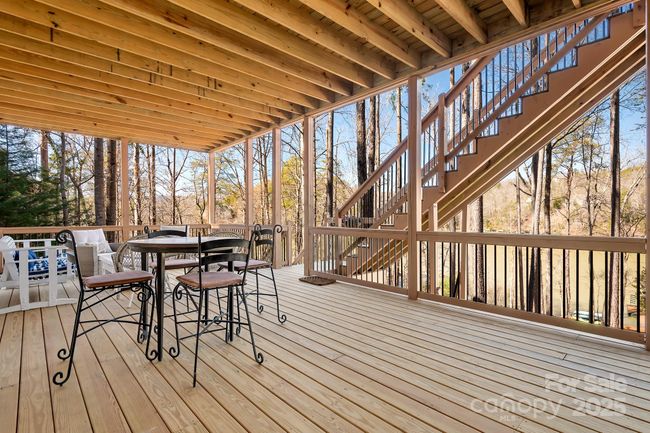 Lower coverend open deck space for relaxing and entertaining. Sweeping views of Lake Adger. | Image 31