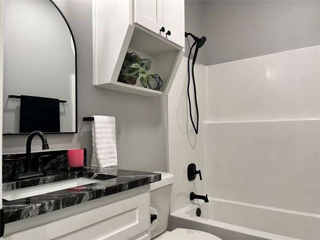Full bath featuring shower combination and vanity | Image 12