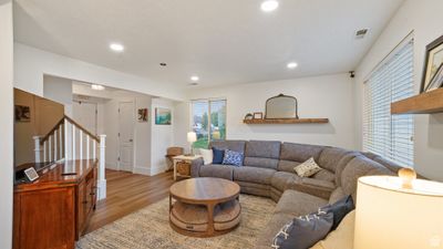 Living room with light wood-type flooring | Image 3