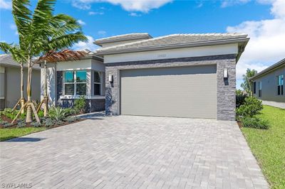 12422 Dahlia Court, House other with 3 bedrooms, 3 bathrooms and null parking in Naples FL | Image 2