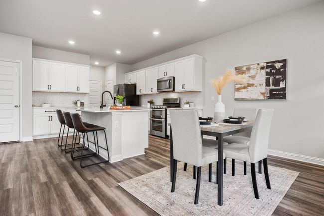 Dining room with dark wood-style floors, recessed lighting, and baseboards | Image 5