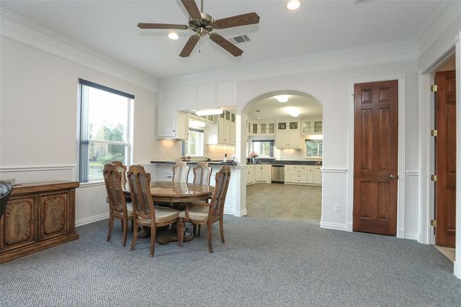Dining area is situated off the kitchen. Breakfast bar for those meals on the go. | Image 25
