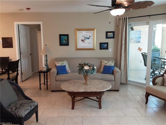 Living room featuring ceiling fan | Image 6