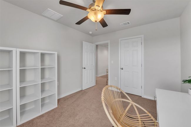 Office space featuring light carpet, ceiling fan, and baseboards | Image 23