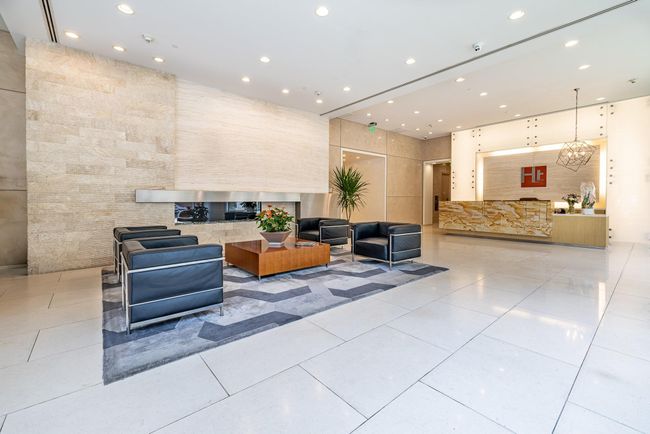 Welcome to Highland Tower's elegant lobby, featuring modern design, plush seating, and sophisticated lighting—a perfect introduction to your future home. | Image 31
