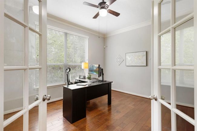 Study is located behind 2nd set of doors at entry. Custom built-in wall of shelves on left wall. | Image 7