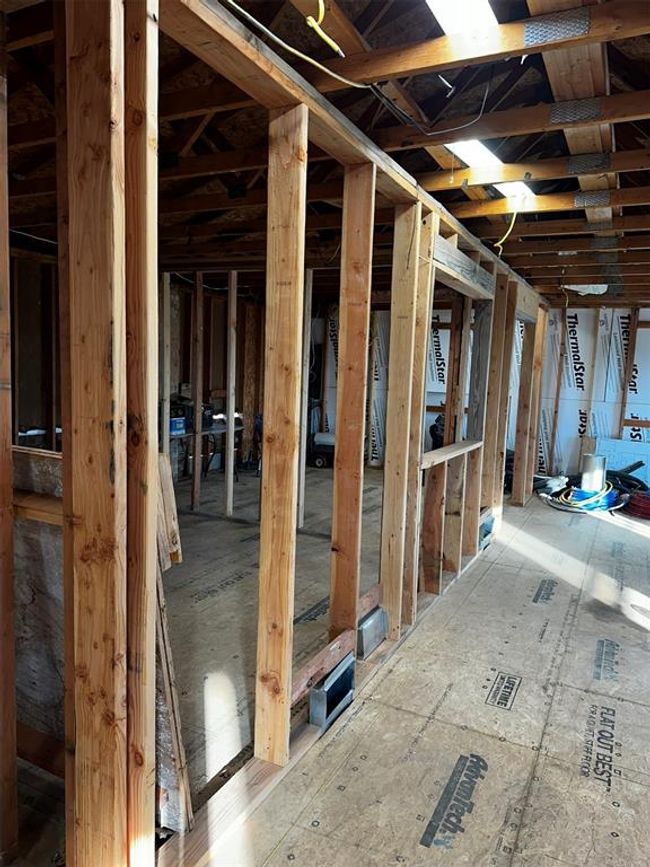 Looking down the 6" center support wall, designed to hold house load to pears under house. Way over built! A built in book shelf in living room or a recessed tv for the Master Bedroom built in. | Image 24