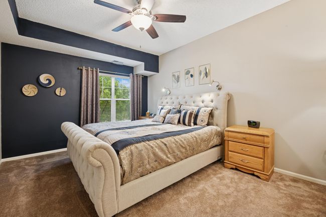 Primary with a ceiling fan, walk-in closet and private bath | Image 4