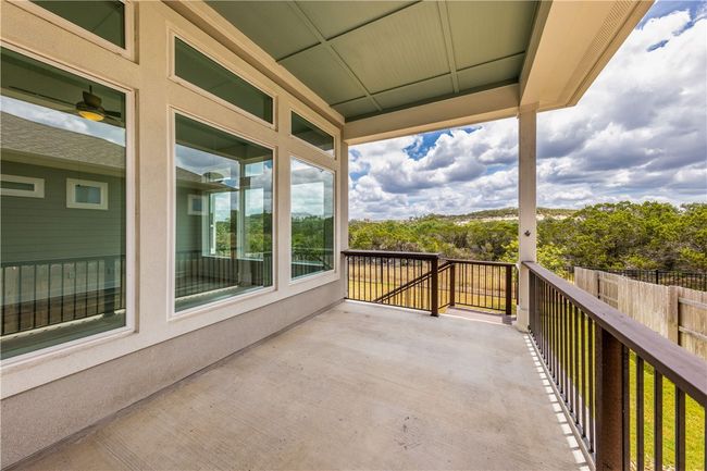 Covered back porch overlooking the greenbelt. | Image 15