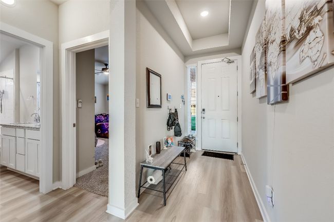 Entrance foyer featuring light wood-style floors, baseboards, and a ceiling fan | Image 7