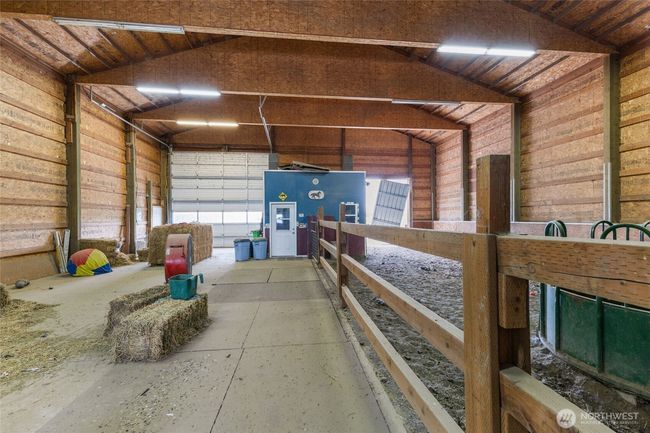 Large barn 60X60 with hay storage on one side and horse barn on the other. Fully enclosed tack room with tons of storage and mini fridge for your animal meds. | Image 31