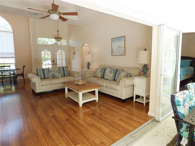 great room and master bedroom have a direct access to the lanai and pool area | Image 15