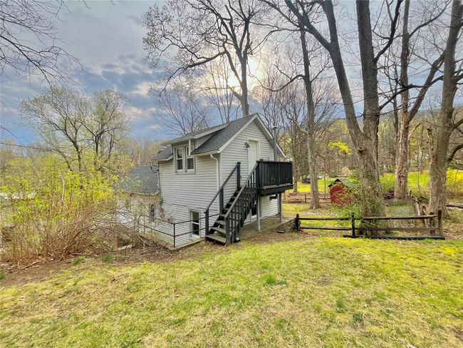 View of outbuilding featuring stairway and fence | Image 11
