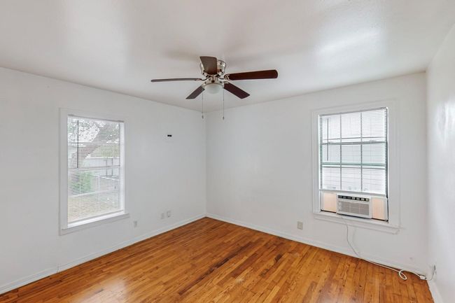 Spare room with light wood-style flooring and ceiling fan | Image 11