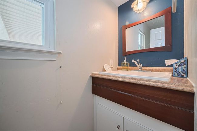 Half bath is conveniently located for guests downstairs or outside by the pool | Image 14