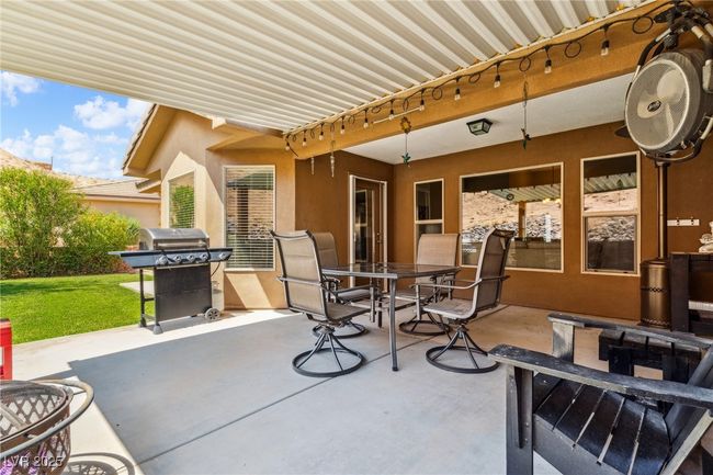 View of patio featuring outdoor dining space and area for grilling | Image 36