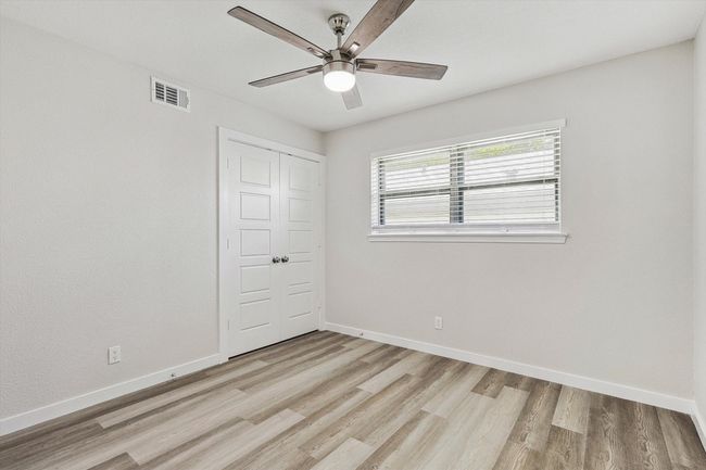 Unfurnished bedroom with baseboards, visible vents, and light wood-type flooring | Image 31