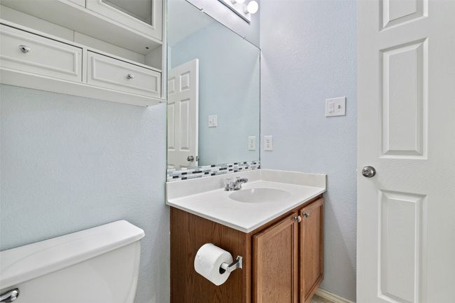Bathroom featuring toilet and vanity | Image 29