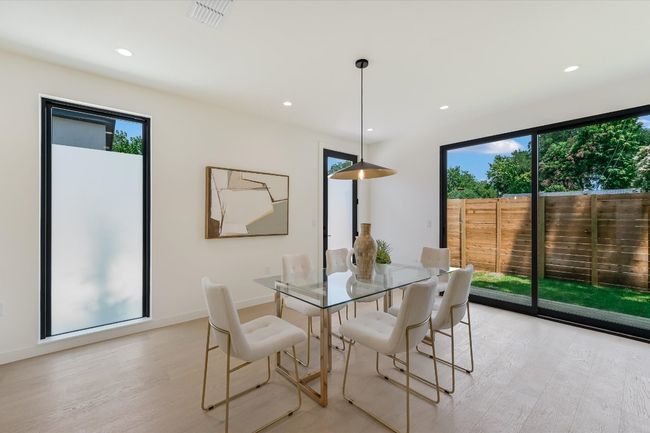 Dining room featuring light wood-style flooring and recessed lighting | Image 15