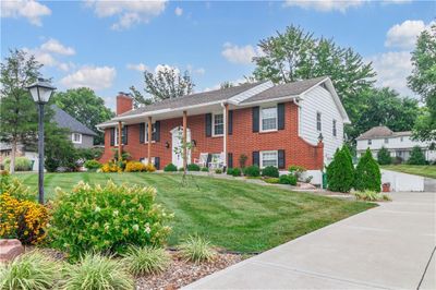 View of front of property featuring a front yard | Image 1