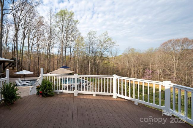 Trex Deck overlooking fenced backyard and saltwater pool | Image 42
