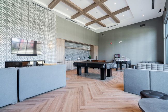 Game room with visible vents, coffered ceiling, pool table, wallpapered walls, and a towering ceiling | Image 31