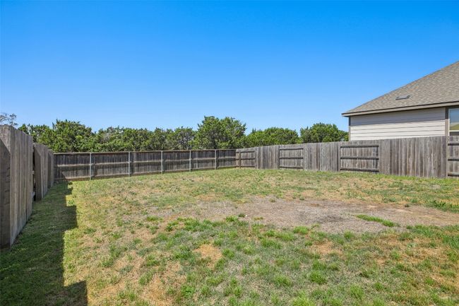 View of yard with a fenced backyard | Image 30