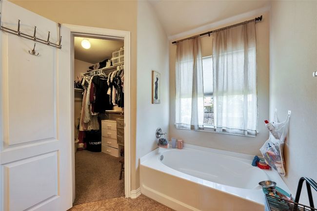 Full bathroom with a garden tub and a spacious closet | Image 16