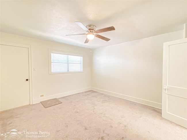 Spare room featuring a ceiling fan and light carpet | Image 25