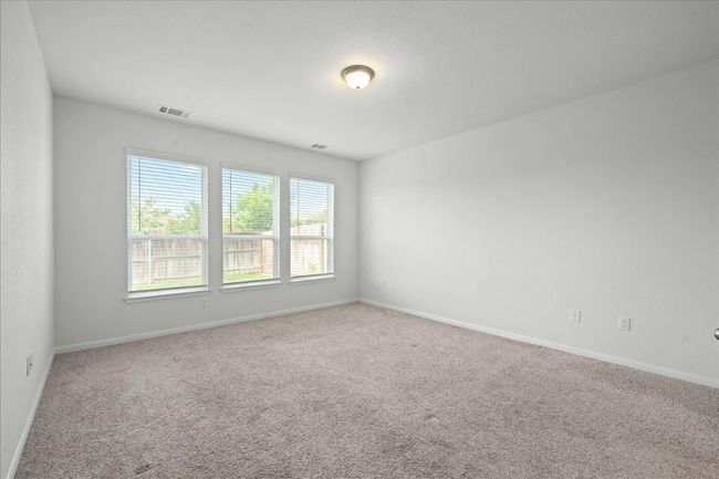 Primary bedroom empty room featuring baseboards | Image 21