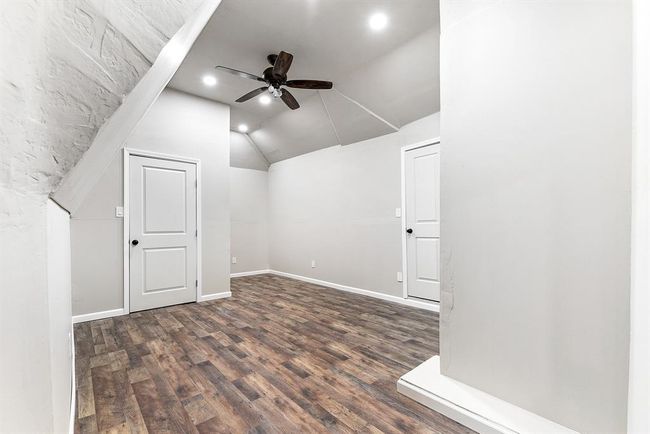 This bonus space was custom-built by the seller and roughed into the attic. While it doesn’t have air conditioning, it offers approximately 150 sq ft of versatile space, complete with a ceiling fan for added comfort. This area can be used for a variety of purposes, such as a playroom, storage, or a unique retreat, depending on your needs. | Image 39