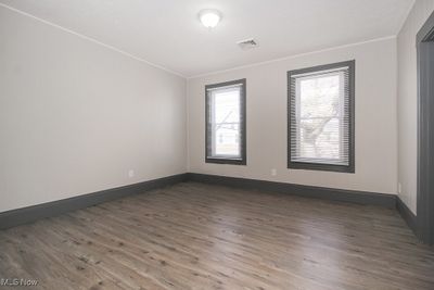 Spare room with wood-type flooring | Image 3