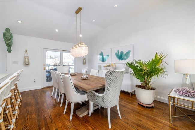 Dining space featuring recessed lighting, baseboards, vaulted ceiling, and dark wood finished floors | Image 4